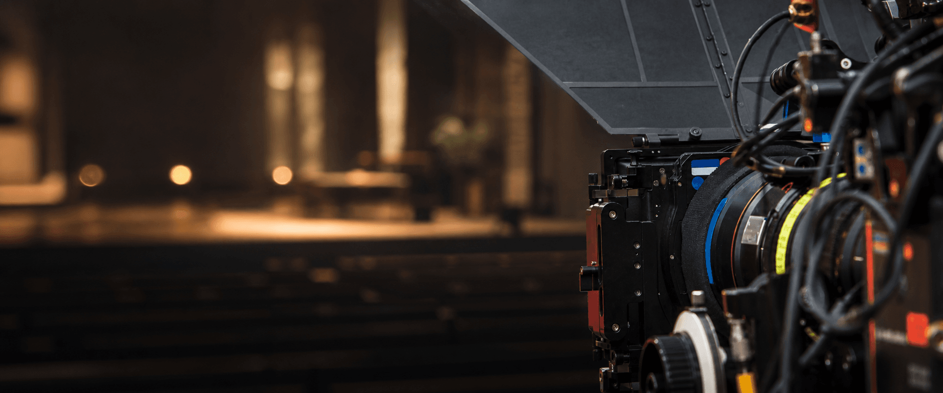 Broadcast camera in a softly lit church sanctuary